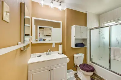 a bathroom with a toilet and a sink and a shower at Between Big Bear and Lake Arrowhead - Cabin with View! in Running Springs