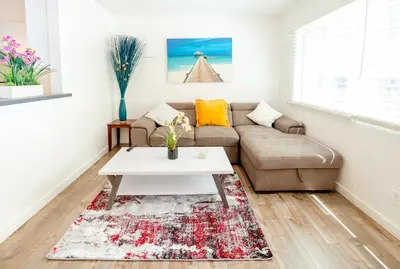 a living room with a couch and a coffee table at Cozy Stylish 1-Bedroom In Hollywood With Free Gated Parking in Los Angeles