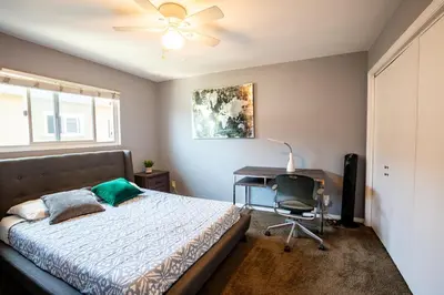 a bedroom with a bed and a desk and a fan at Renovated Culver City Escape Walkable WFH in Los Angeles
