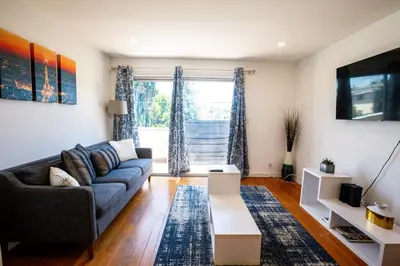 a living room with a couch and a table at Renovated Culver City Escape Walkable WFH in Los Angeles