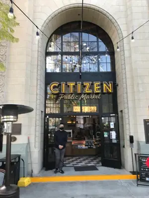 a man standing in the doorway of a building at Renovated Culver City Escape Walkable WFH in Los Angeles