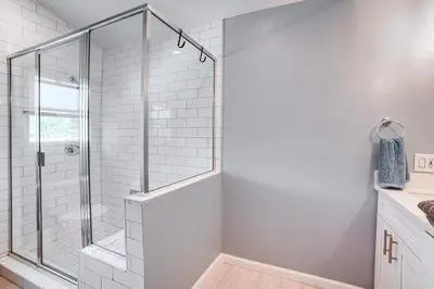 a shower with a glass door in a bathroom at Golf, Swim, Relax Family Retreat in Corona! in Corona