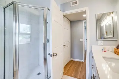 a bathroom with a shower and a sink at Golf, Swim, Relax Family Retreat in Corona! in Corona