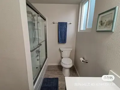 a bathroom with a toilet and a glass shower at 1 bedroom in a quiet neighborhood near the main street - Room B in Rowland Heights