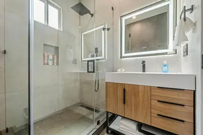 a bathroom with a sink and a shower at The Valley Nest Backyard Gameroom in Los Angeles