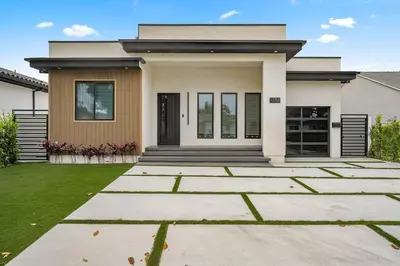 a house with a lawn in front of it at The Valley Nest Backyard Gameroom in Los Angeles