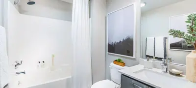 a bathroom with a toilet and a sink and a shower at Noho Haven 2 bed Apt with FREE Parking in North Hollywood