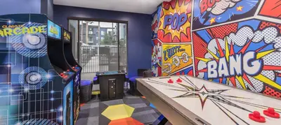 a play room with a pinball machine and a bowling alley at Noho Haven 2 bed Apt with FREE Parking in North Hollywood