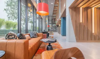 a lobby with couches and a table in a building at Modern 1BR Apartment with Pool, Hot Tub and Gym Access 10mins to Universal Studios in Los Angeles