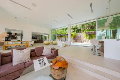 a living room with a couch and a table at Zen Estate in Los Angeles