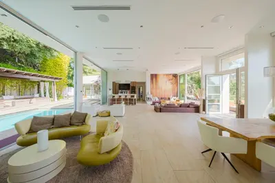 a living room with a pool and a dining room at Zen Estate in Los Angeles