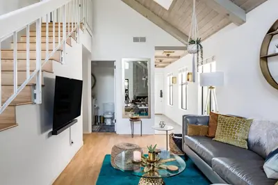 a living room with a couch and a table at Silver Triangle Oasis with Verdant Backyard in Los Angeles