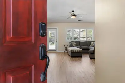 a door leading to a living room with a couch at Relaxing 4BR 2BA Sleeps 8 Family Friendly in Bakersfield