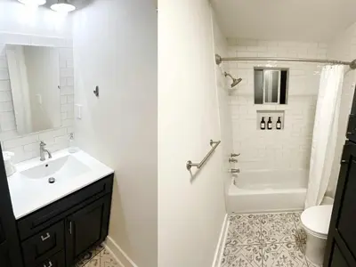 a white bathroom with a sink and a toilet at Montecito Heights Hideaway in Los Angeles