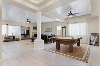 a large living room with a pool table in it at Stylish Silver Falls 4BR KING Master Game Room in Bakersfield