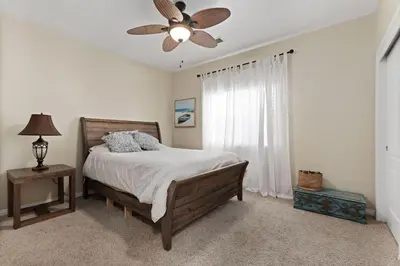 a bedroom with a bed and a ceiling fan at Stylish Silver Falls 4BR KING Master Game Room in Bakersfield