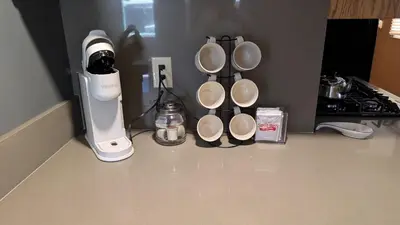 a kitchen counter with a blender and coffee cups at Peaceful Pines Place, a cozy mountain hideaway wAC