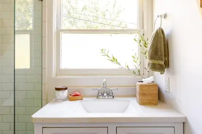 a bathroom with a sink and a window at Serene & beautiful bohemian hilltop retreat in Glendale