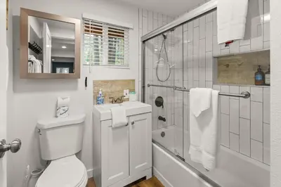 a bathroom with a toilet and a shower and a sink at Cozy Knight Cabin - AC! Walk to Lake and Village in Big Bear Lake