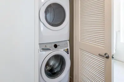a washing machine and a dryer in a room at Luxury 2 Bedroom 2 Bathroom Residence With Fitness and Outdoor Pool in Los Angeles