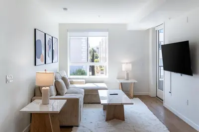 a living room with a couch and a tv at Luxury 2 Bedroom 2 Bathroom Residence With Fitness and Outdoor Pool in Los Angeles