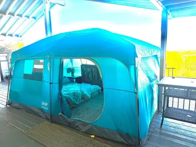 a blue tent with a bed in it at Glamping Cabin Tent Heated View Deck 2Acre Estate - Female Share Indoor - Men Share Outdoor - RG in Encino