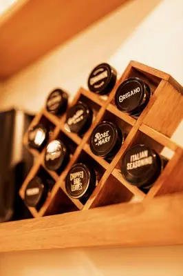 a bunch of bottles of wine in a wooden box at Little Wolf Lodge Modern Cabin at Lake Gregory in Crestline
