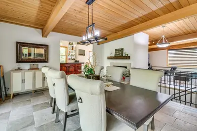 a dining room with a table and chairs at Play, Swim and Unwind Luxe Los Angeles Oasis! in Chatsworth Lake Manor
