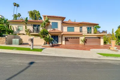 a large house with a large driveway at Play, Swim and Unwind Luxe Los Angeles Oasis! in Chatsworth Lake Manor