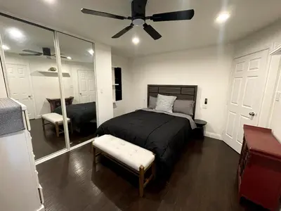 a bedroom with a bed and a ceiling fan at House in Redondo Beach 2 bedroom 1 bath in Redondo Beach