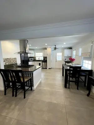 a kitchen and living room with a table and chairs at House in Redondo Beach 2 bedroom 1 bath in Redondo Beach