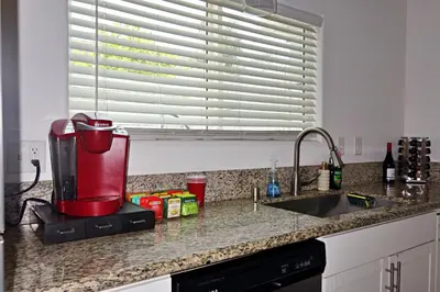 a kitchen counter with a blender on a counter top at Casa Mid City - Centrally Located 1BR Getaway with Private Yard in Los Angeles