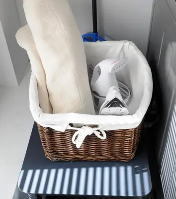 a basket with a hair dryer and other items in a vehicle at Champagne Retreat in Upland