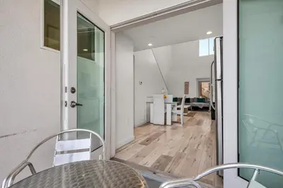 a dining room with a table and chairs at Koreatown Hollywood Urban Oasis 1 Bedroom Loft with Private Parking and Balcony in Los Angeles