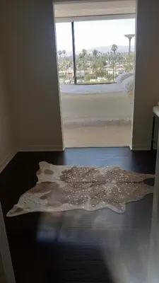 a rug on the floor in a bedroom with a window at A Stunning Luxury Resort-Style Furnished Condominium Plus All Inclusive Amenities! in Los Angeles