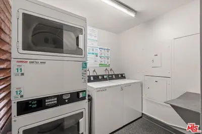 a kitchen with a microwave above a stove at A Stunning Luxury Resort-Style Furnished Condominium Plus All Inclusive Amenities! in Los Angeles