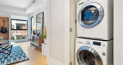 a laundry room with a washer and dryer at Loft & Luxe Hollywood with FREE PARKING in Los Angeles
