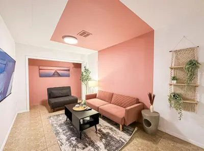 a living room with a couch and a table at Relaxed and Cozy Poolside Studio - LOU2 - BUR in Burbank