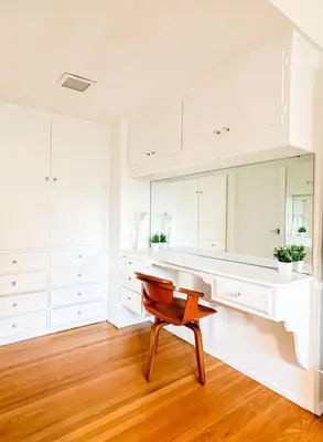 a white kitchen with a desk and a chair at 6BR Pool Escape for Friends and Family - LOU1 - BUR in Burbank