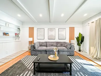 a living room with a couch and a coffee table at 6BR Pool Escape for Friends and Family - LOU1 - BUR in Burbank