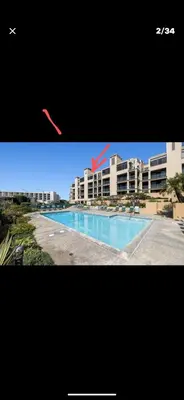 a kite flying in the air over a swimming pool at 31 night required rental Waterfront penthouse 180 ocean view in Redondo Beach
