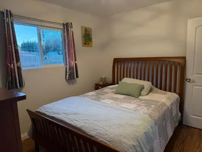 a bedroom with a bed and a window at Cozy Mountain Retreat in Frazier Park