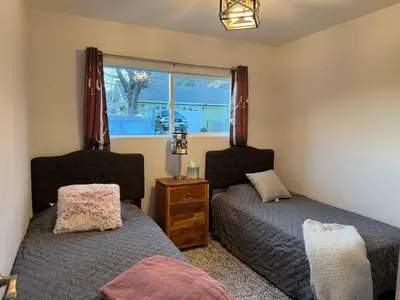a bedroom with two beds and a window at Cozy Mountain Retreat in Frazier Park