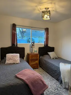 a bedroom with two beds and a window at Cozy Mountain Retreat in Frazier Park