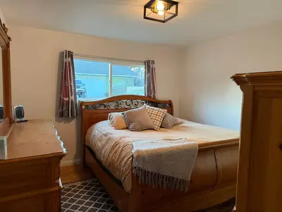 a bedroom with a bed and a window at Cozy Mountain Retreat in Frazier Park
