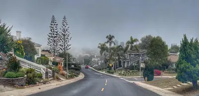 an empty street in a residential neighborhood with houses at The Luxe Escape | Near LAX & West LA Hotspots in Los Angeles