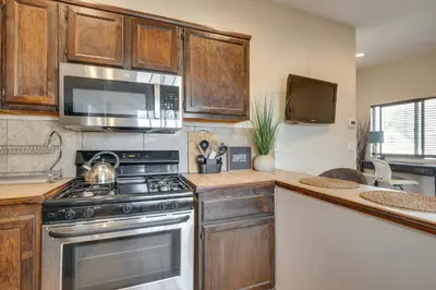 a kitchen with a stove and a microwave at 4 Mi to Beverly Hills Quiet LA Gem with Shared Yard in Los Angeles