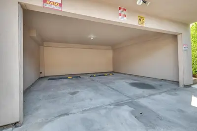 an empty garage with a garage door open at 4 Mi to Beverly Hills Quiet LA Gem with Shared Yard in Los Angeles