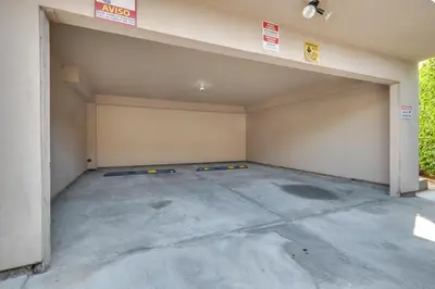 an empty garage with a garage door open at 4 Mi to Hollywood Mid-Wilshire Couples Retreat in Los Angeles