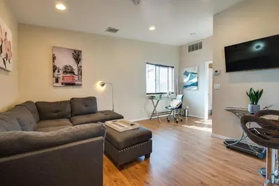 a living room with a couch and a table at 9 Mi to Airport WFH-Friendly Apt in Los Angeles! in Los Angeles